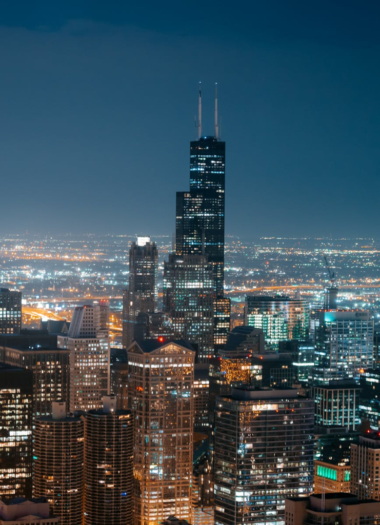A captivating view of Chicago's illuminated skyline featuring the iconic Willis Tower.
